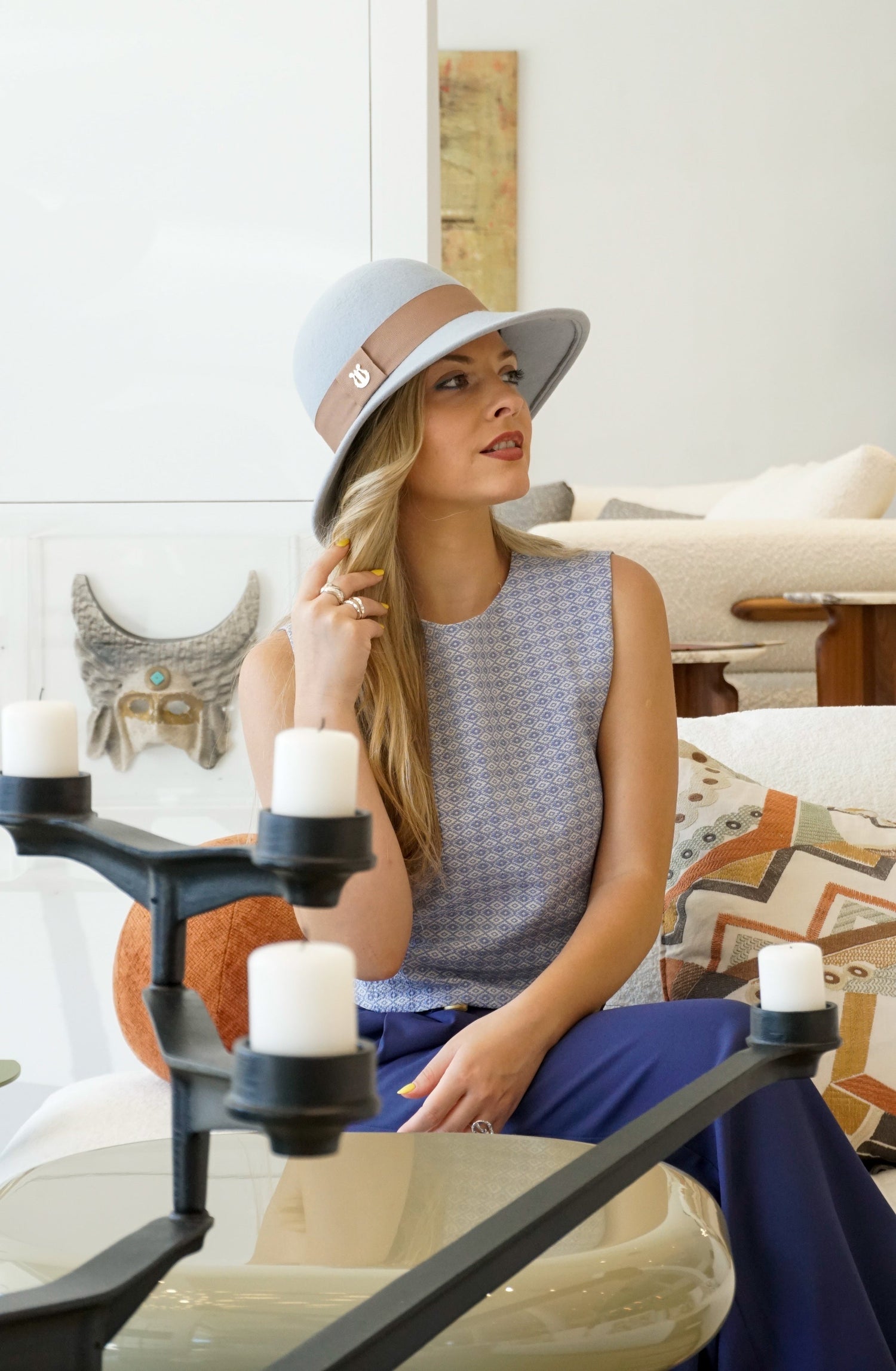 Luxury Mediterranean-inspired Hats & Headpieces by Anna Xaniotaki,  for Royal Ascot, race days, weddings & everyday elegance.  Meet the Celestia in Powder Blue wool felt with nude band & lyre jewel. Bespoke couture Greek millinery.