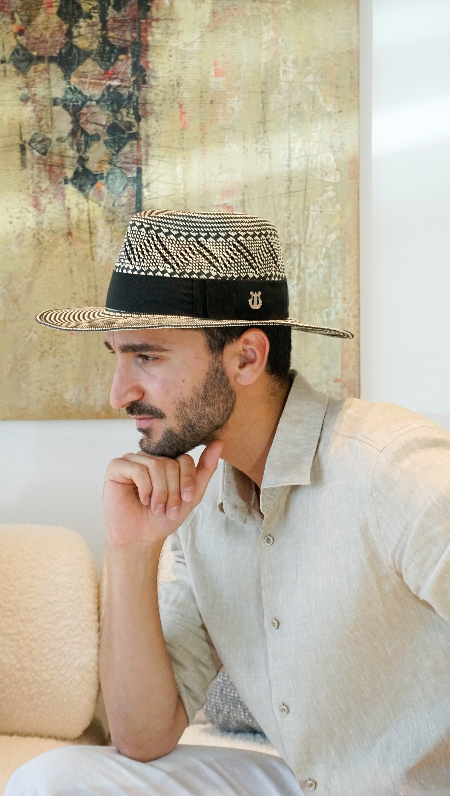 Hats for Gentlemen. Bespoke custom handmade mens fedoras by Anna Xaniotaki for race days, weddings and everyday style. Meet the Odysseus Hat in black & ivory Straw, with sterling lyre jewel 