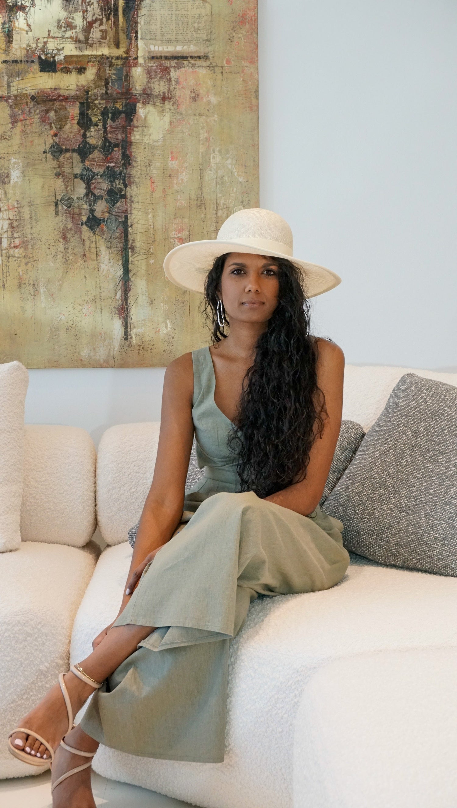 An Ode to Race Day Hats Collection. Luxury race day hats & headpieces for women by Anna Xaniotaki. Meet the Hera Hat in champagne ramie-sisal straw & gold jewellery. Bespoke couture Greek millinery.