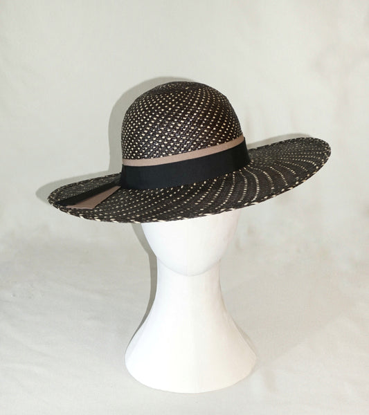 Black and ivory geometric Panama hat with gold lyre emblem by Anna Xaniotaki- front view