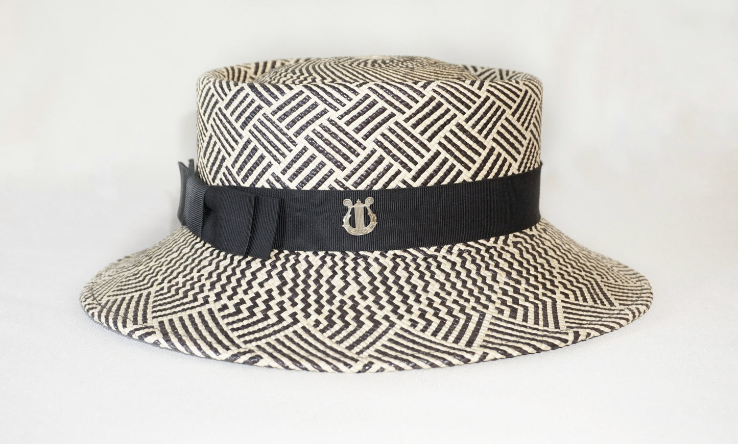 Leto Ode boater hat in Panama straw by Anna Xaniotaki - side and back view showing sterling silver lyre and double black bow