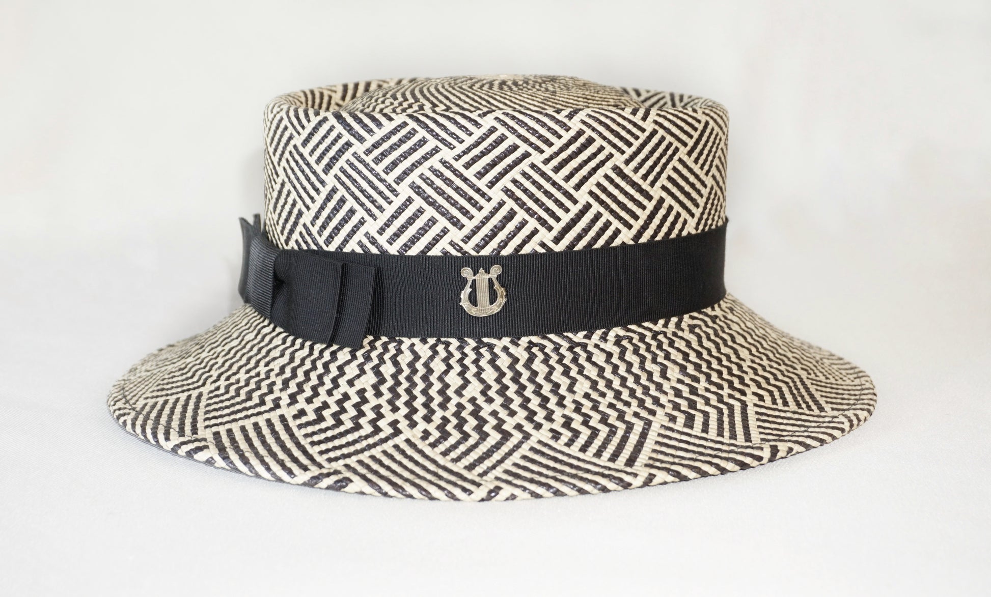 Leto Ode boater hat in Panama straw by Anna Xaniotaki - side and back view showing sterling silver lyre and double black bow