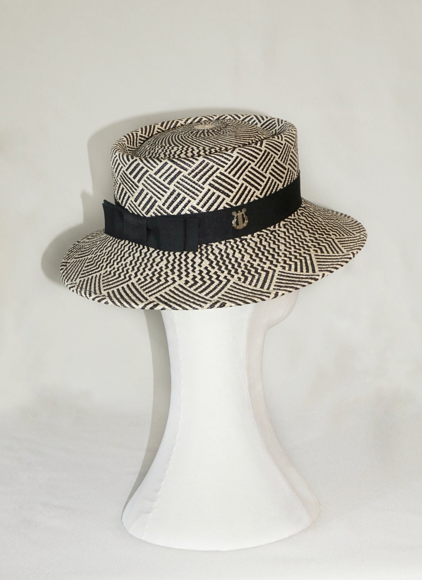 Leto Ode boater hat in Panama straw by Anna Xaniotaki, side and back view showing sterling silver lyre and double black bow