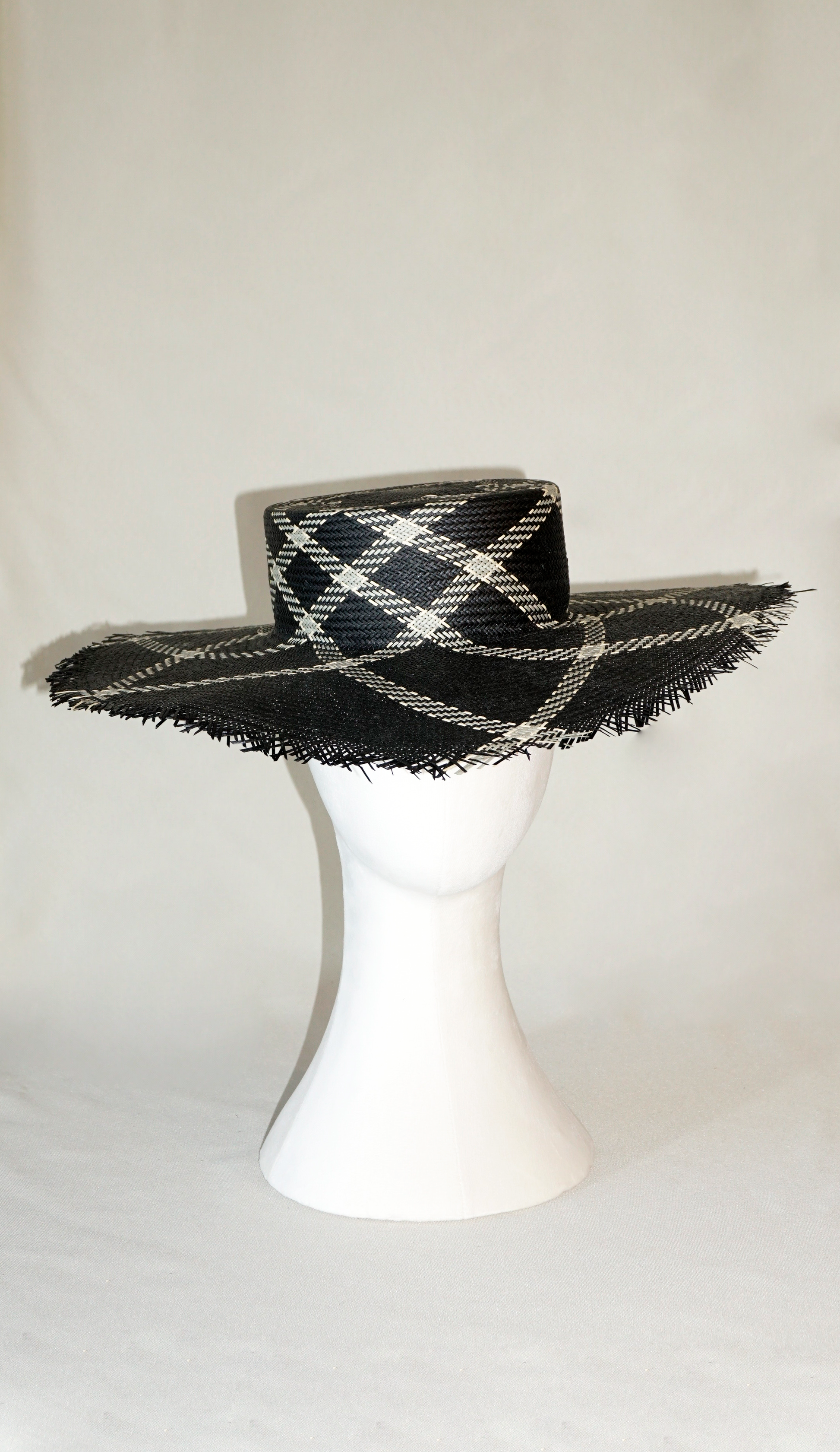 Aura hand-woven wide brim hat, black Toyo paper straw, ivory & black geometric plaid, bohemian sculptural presence, front view by Anna Xaniotaki