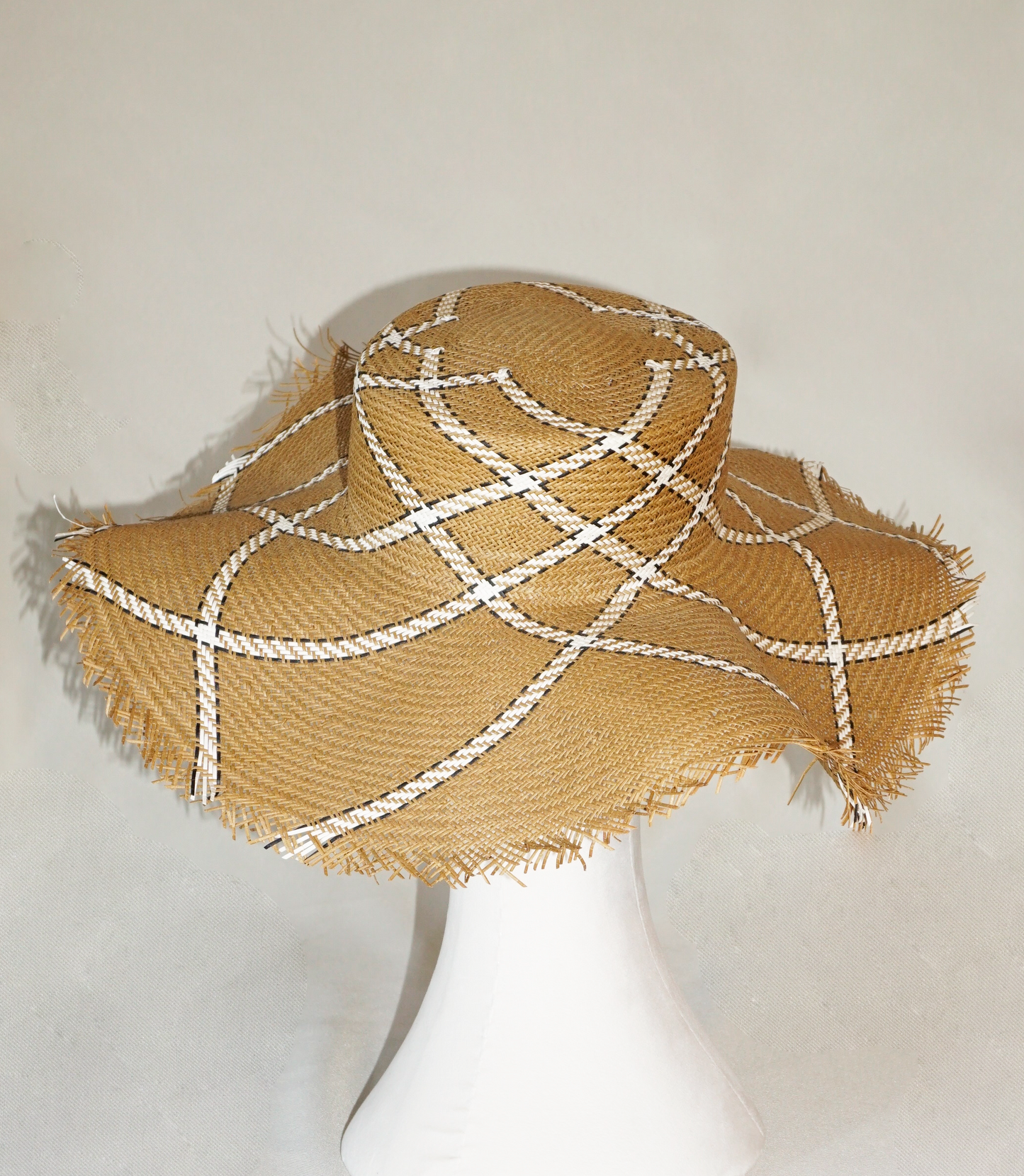 Aura hand-woven wide brim hat, golden chestnut Toyo paper straw, ivory & black geometric plaid, bohemian sculptural presence, back view by Anna Xaniotaki