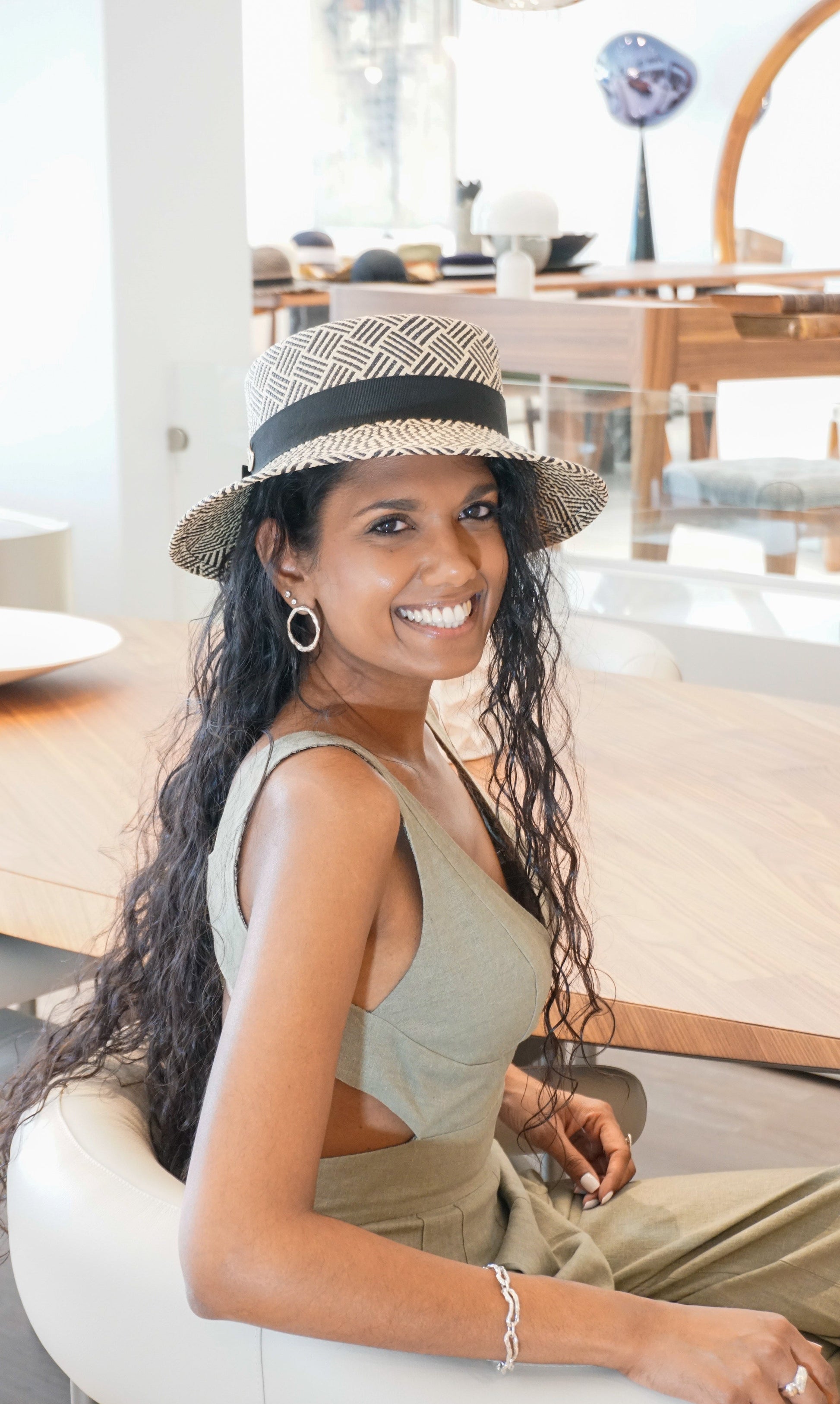 Leto Ode boater hat in Panama straw with black bow and sterling silver lyre by Anna Xaniotaki - three-quarter view