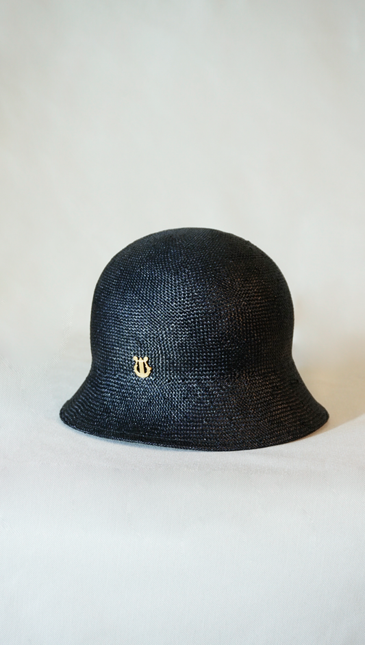 Nyx Cloche Hat in Visca Straw in Black with a Gold Lyre by Anna Xaniotaki