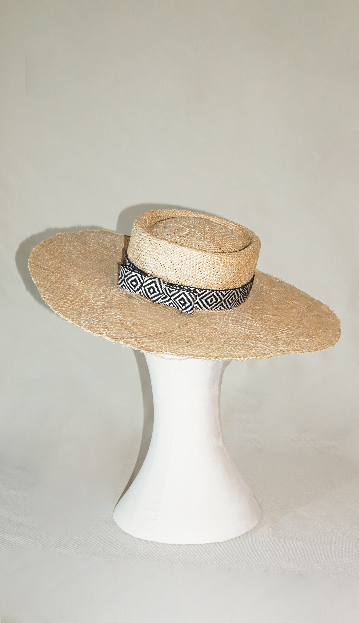 Delos handmade wide brim boater hat, pork pie crown, natural raffia straw,  woven black & ivory geometric band with back bow, back & top view by Anna Xaniotaki 