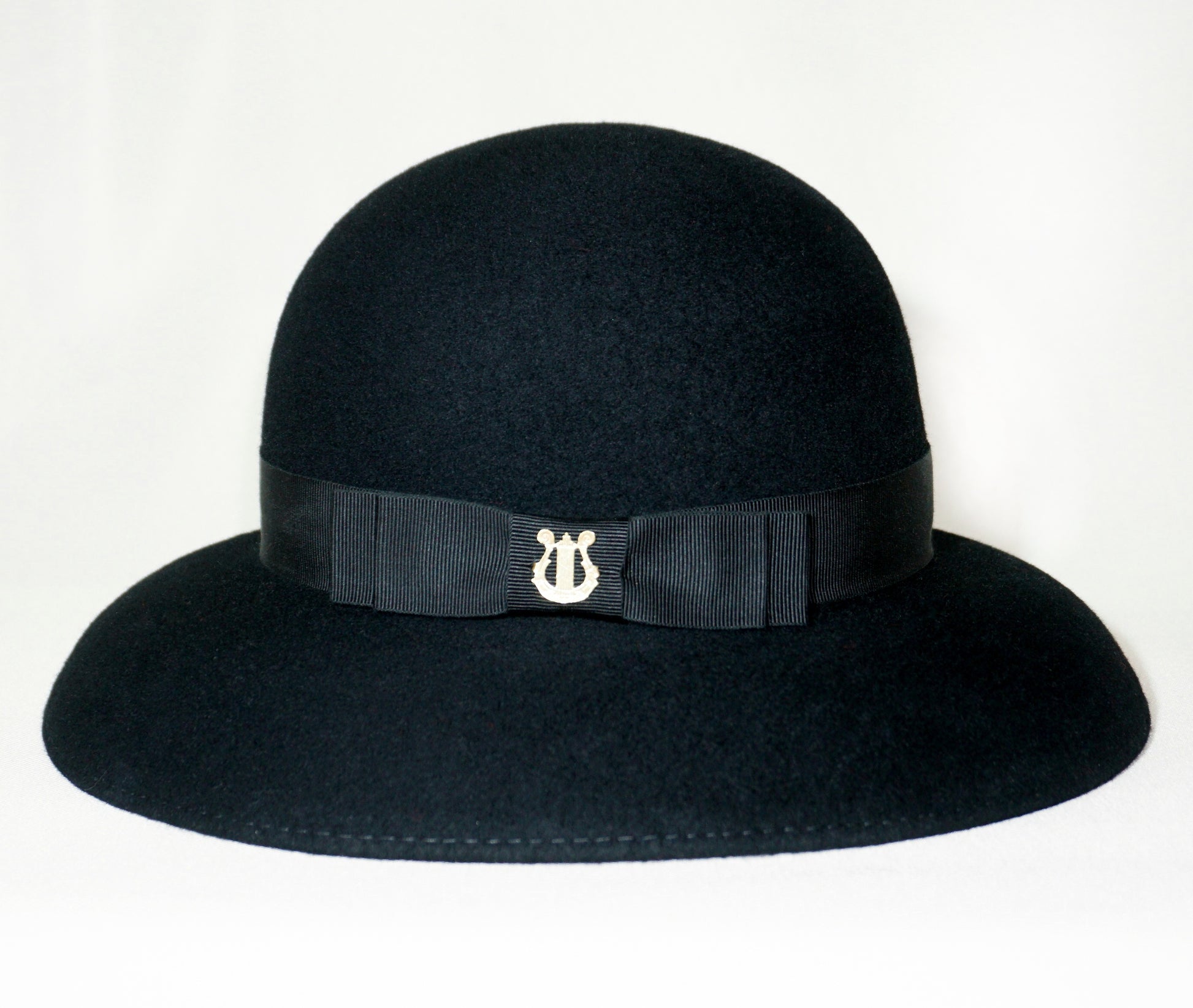 Noir Elegance Hat in Wool Felt with Bow and Gold Lyre by Anna Xaniotaki - bow detail, side view