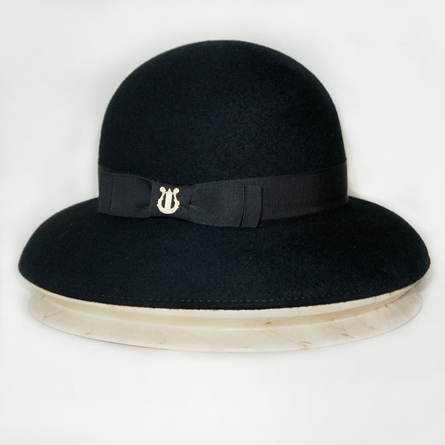 Noir Elegance Hat in Wool Felt with Bow and Gold Lyre by Anna Xaniotaki