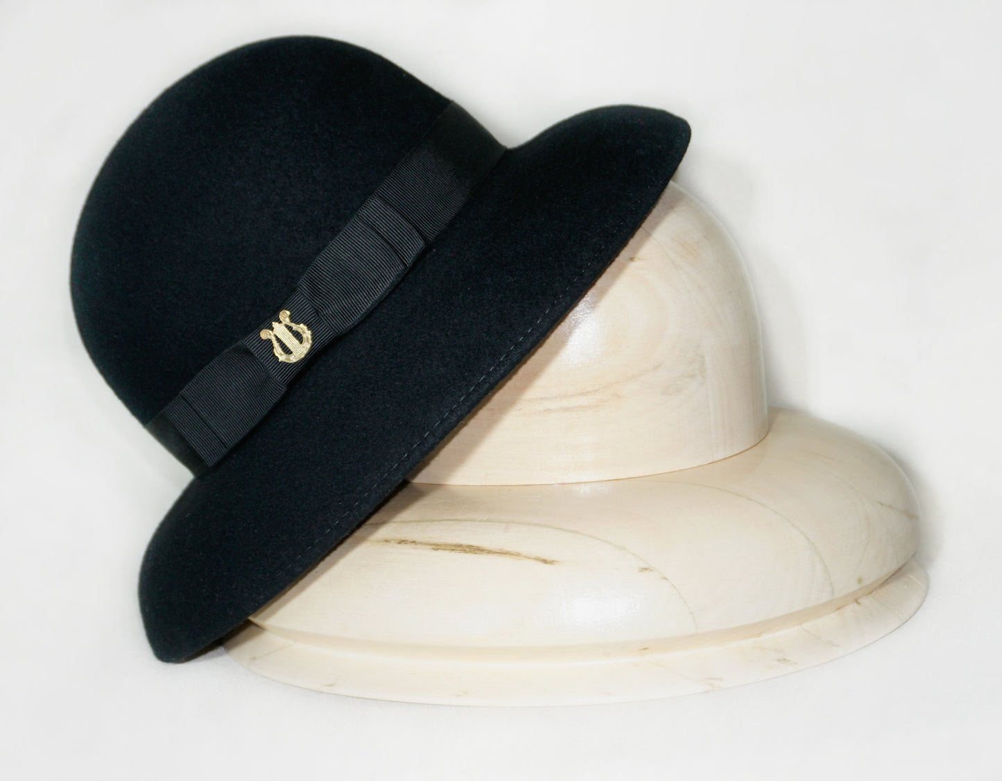 Noir Elegance Hat in Wool Felt with Bow and Gold Lyre by Anna Xaniotaki - bow detail, side view