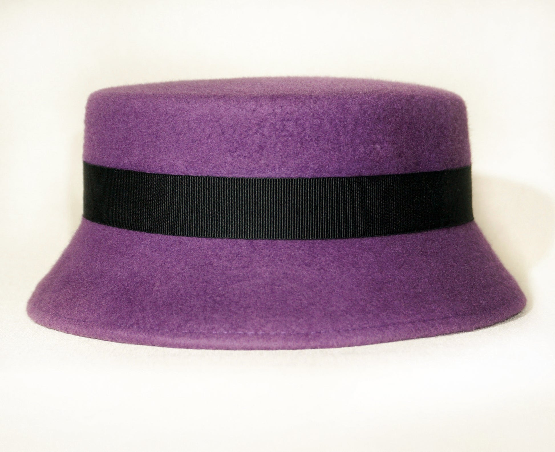 Aristocratic Melody Pillbox Hat in Royal Purple Wool Felt with Black Double Bow and Gold Lyre by Anna Xaniotaki - back view