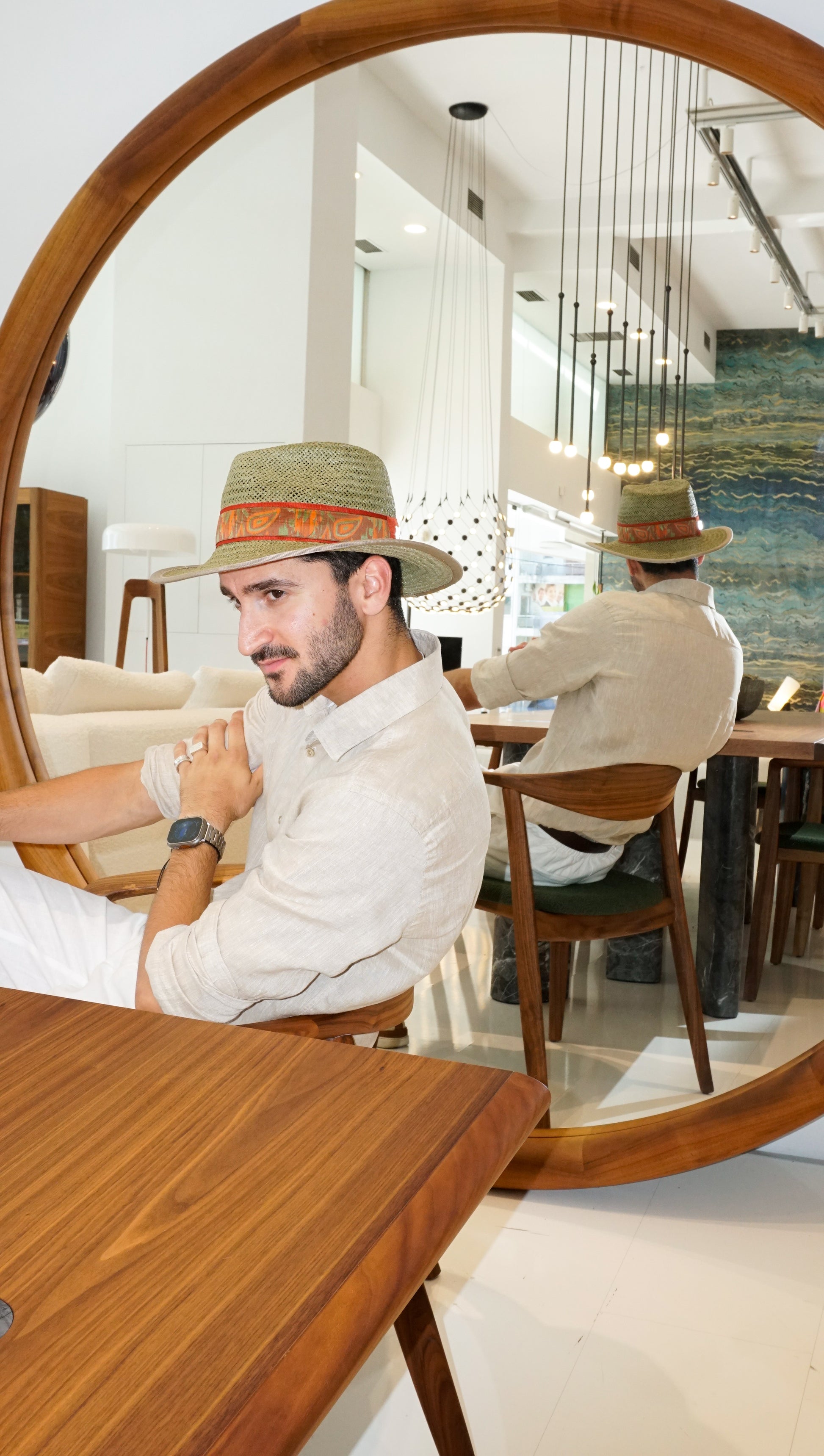 Man wearing the Indy Safari Fedora Hat in olive green paper straw with coral Italian cotton grosgrain ribbon and woven orange, coral and green band, three-quarter front left side view and mirror three-quarter back view. Custom made-to-order fedora for summer special occasions, garden parties, vacations or for everyday man's elegance. Bespoke couture millinery by Anna Xaniotaki.