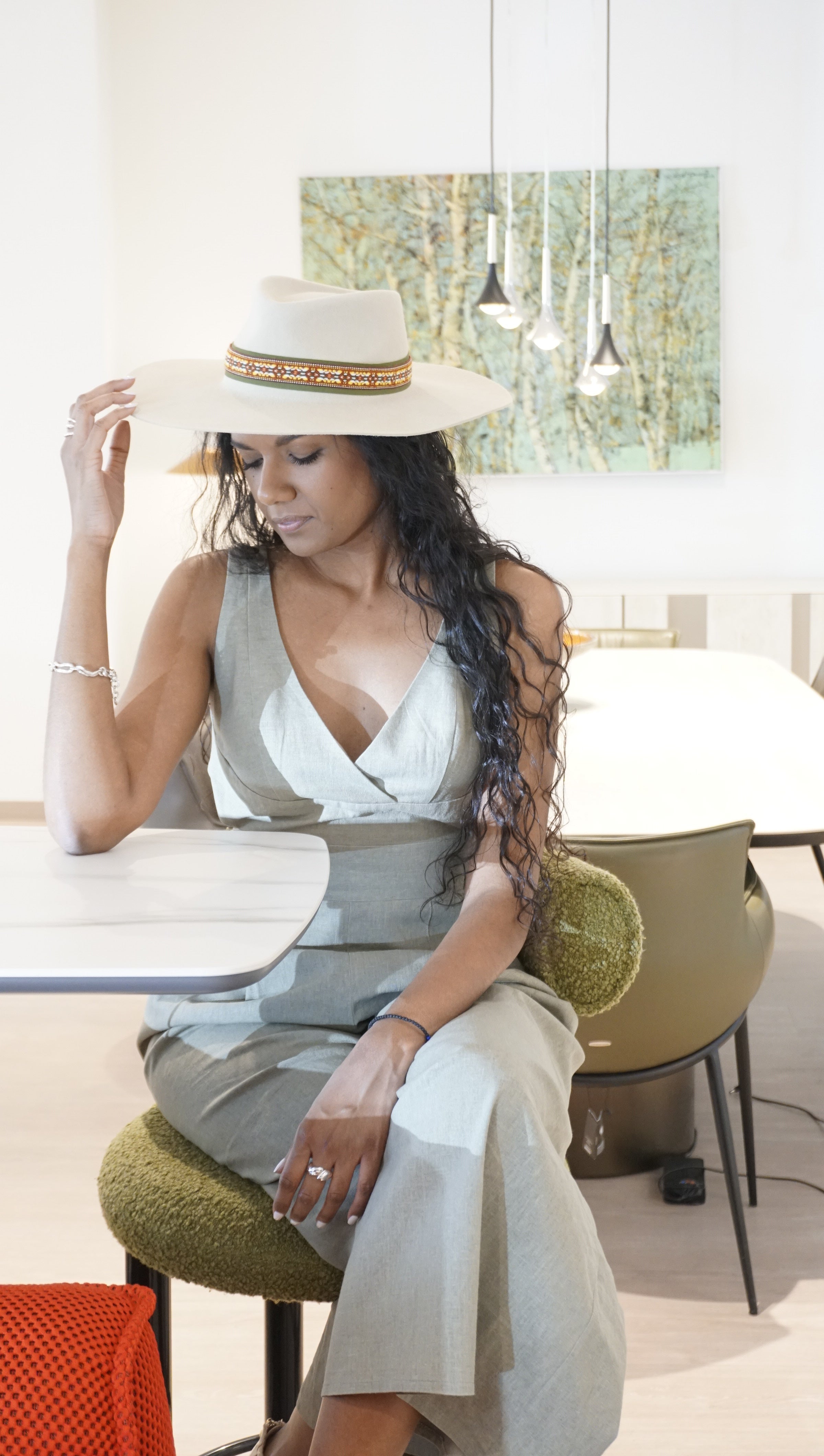 Iokasti Fedora in rabbit fur felt Hat in light cream with a delicate Italian green cotton grosgrain ribbon, a woven ribbon in green, gold and amber tones, and our signature 925 sterling silver lyre by Anna Xaniotaki 