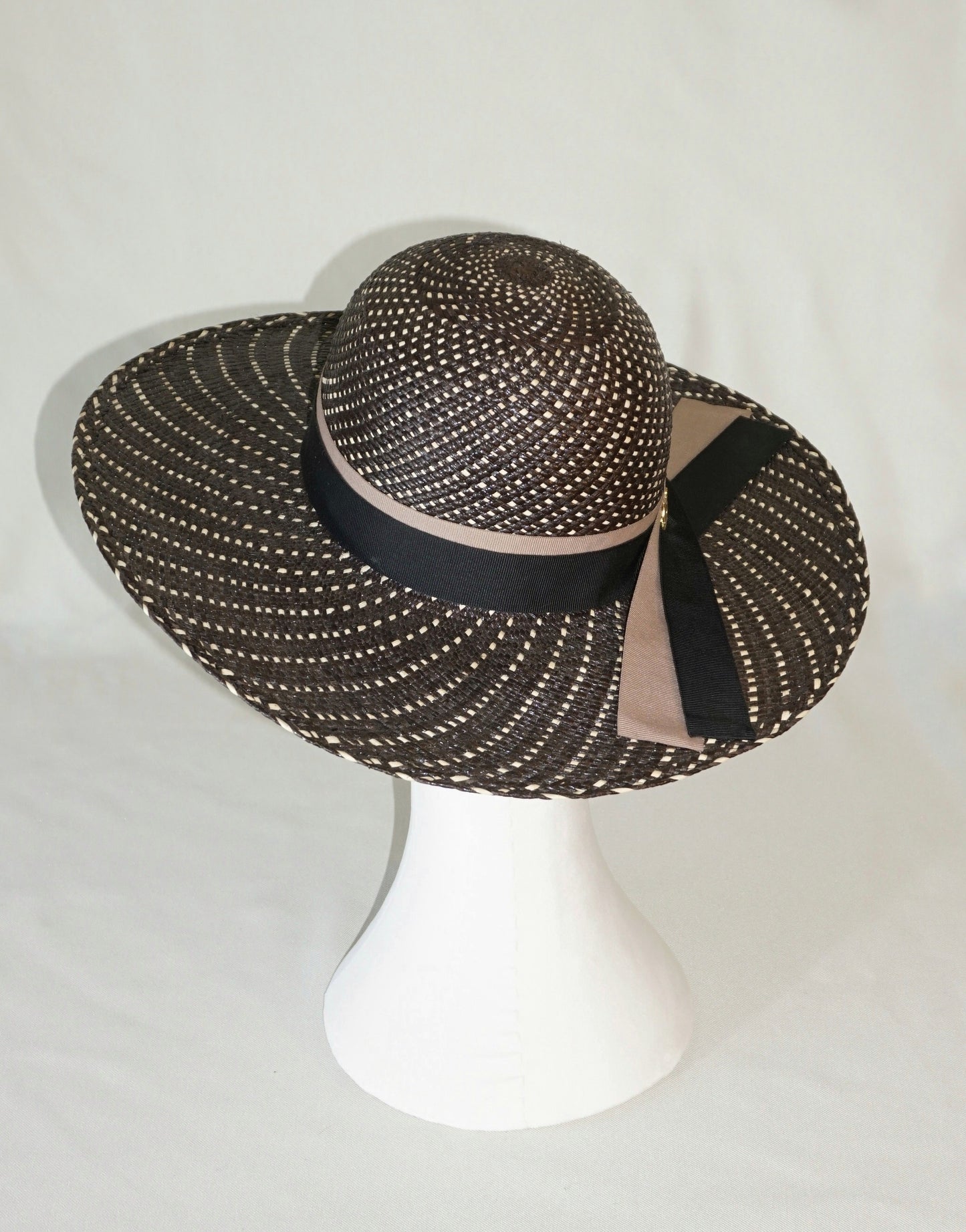 Black and ivory Panama hat with black and nude blush ribbons and gold lyre, back view by Anna Xaniotaki