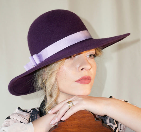 La Violette Nocturne Orchid Purple Felt Hat with Lavender Purple Double Bow & Gold Lyre by Anna Xaniotaki - three-quarter view
