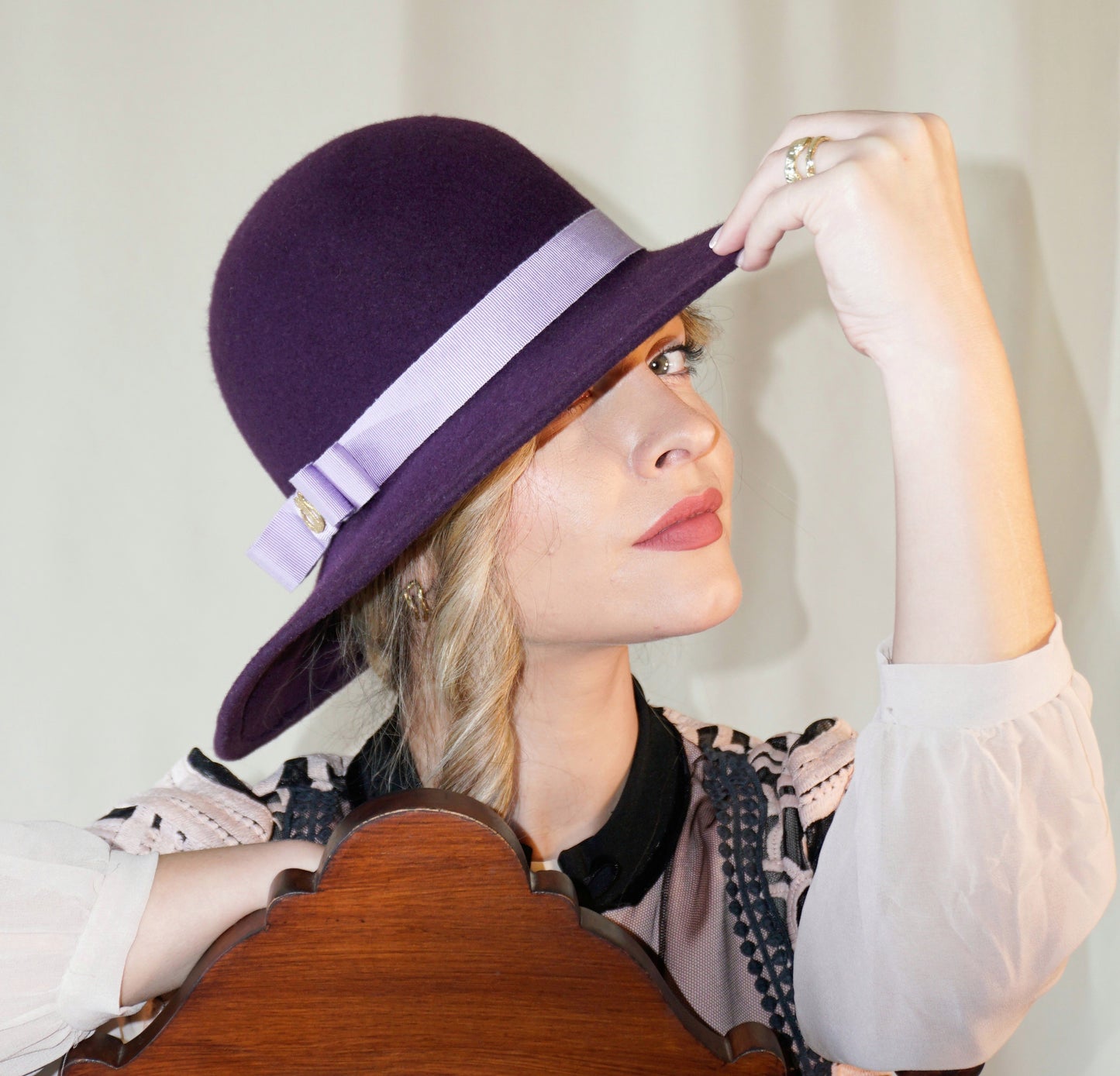 La Violette Nocturne Orchid Purple Felt Hat with Lavender Purple Double Bow & Gold Lyre by Anna Xaniotaki - three-quarter view