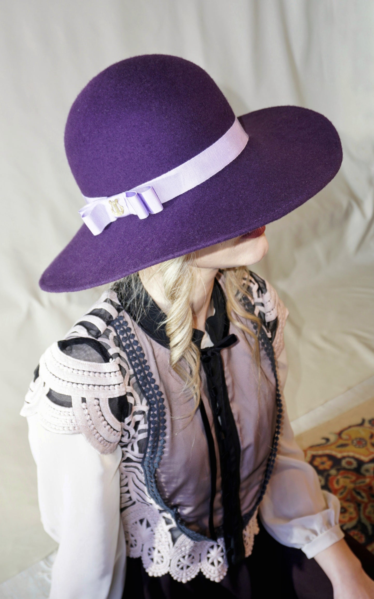 La Violette Nocturne Orchid Purple Felt Hat with Lavender Purple Double Bow & Gold Lyre by Anna Xaniotaki - three-quarter view
