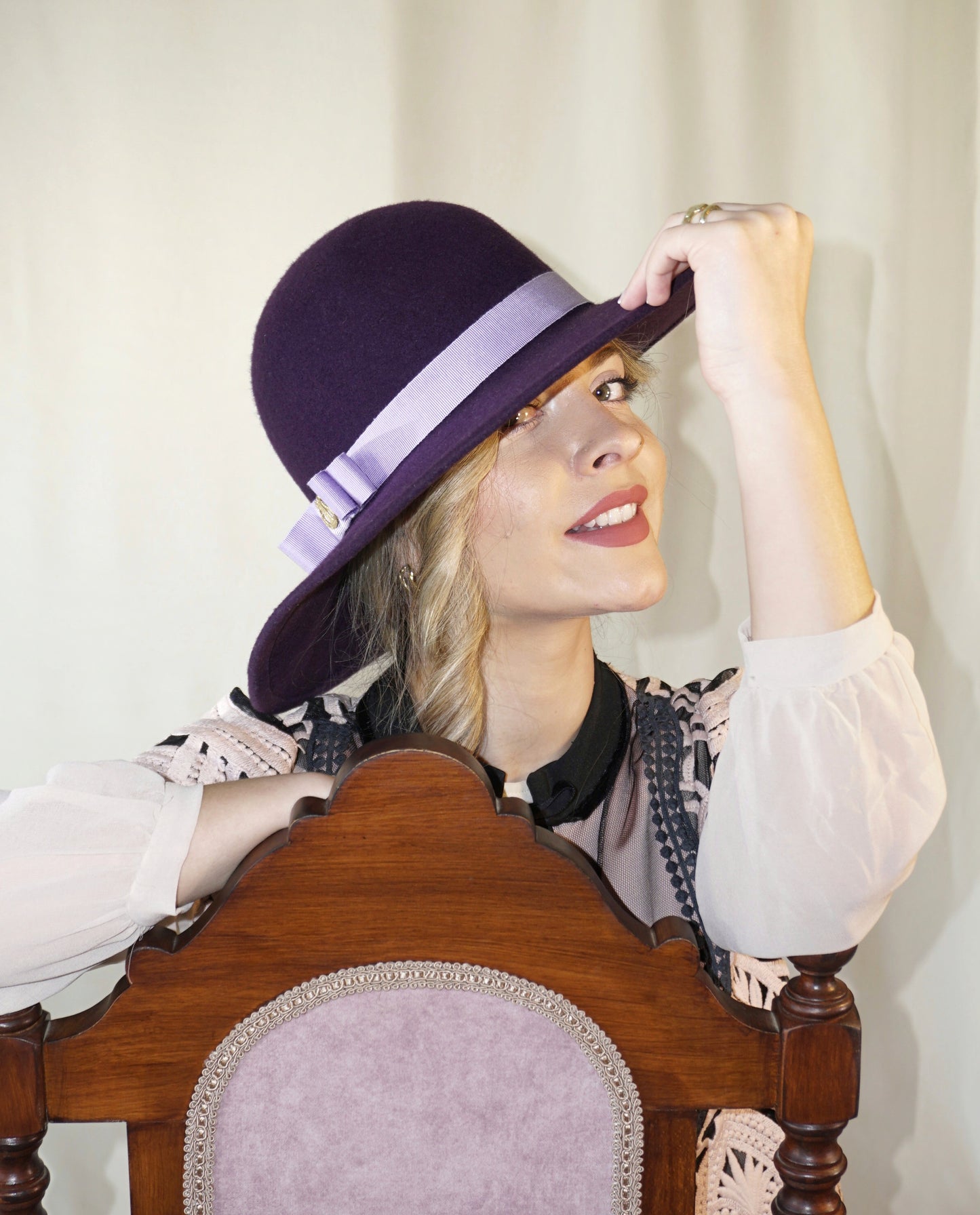 La Violette Nocturne Orchid Purple Felt Hat with Lavender Purple Double Bow & Gold Lyre by Anna Xaniotaki - three-quarter view