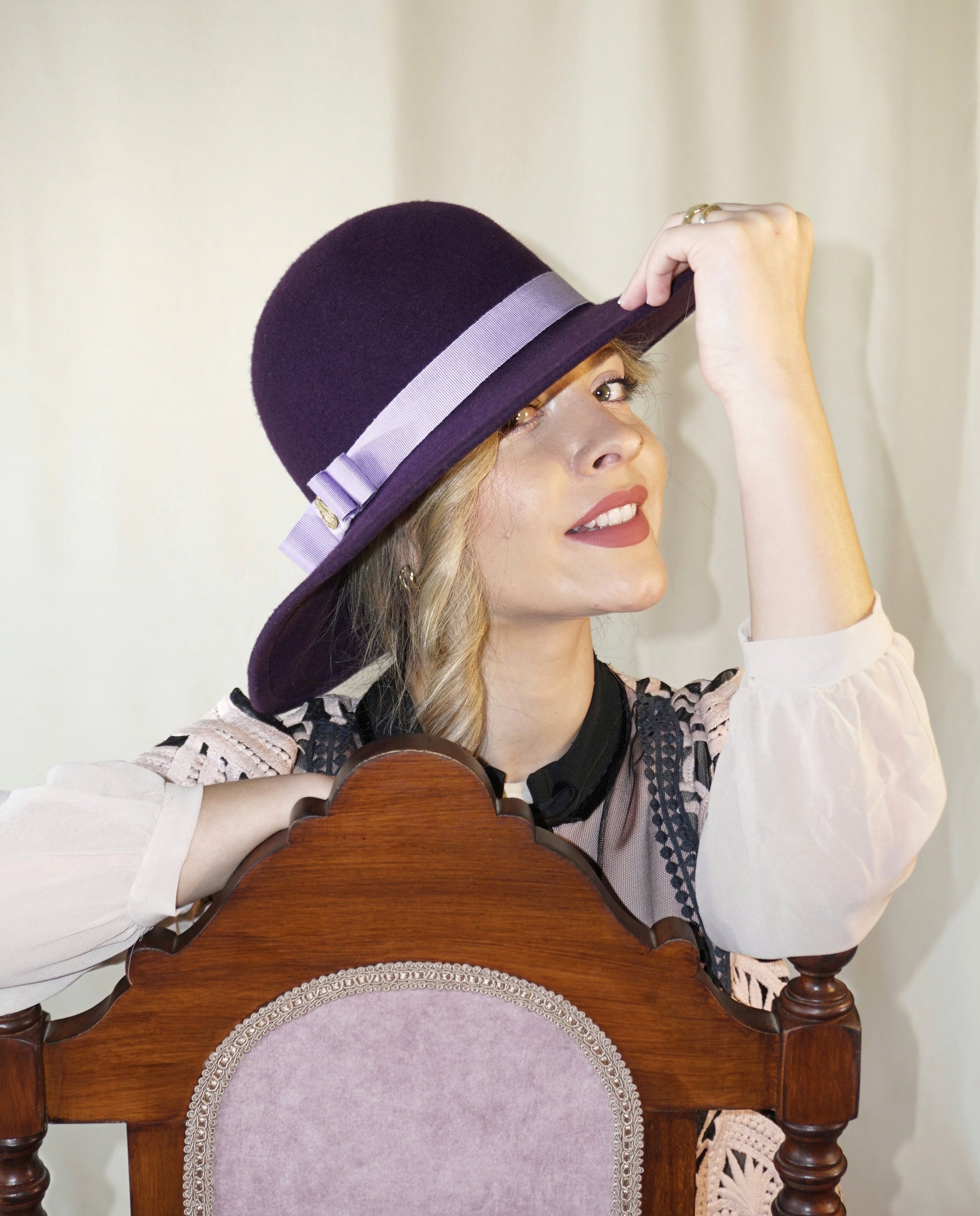 La Violette Nocturne Orchid Purple Felt Hat with Lavender Purple Double Bow & Gold Lyre by Anna Xaniotaki - three-quarter view