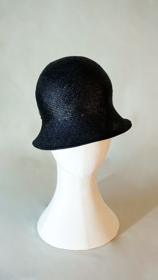 Nyx Cloche Hat in Visca Straw in Black with a Gold Lyre by Anna Xaniotaki, front view