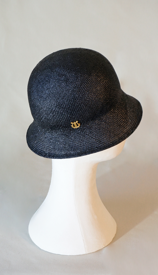 Nyx Cloche Hat in Visca Straw in Black with a Gold Lyre by Anna Xaniotaki, right side view