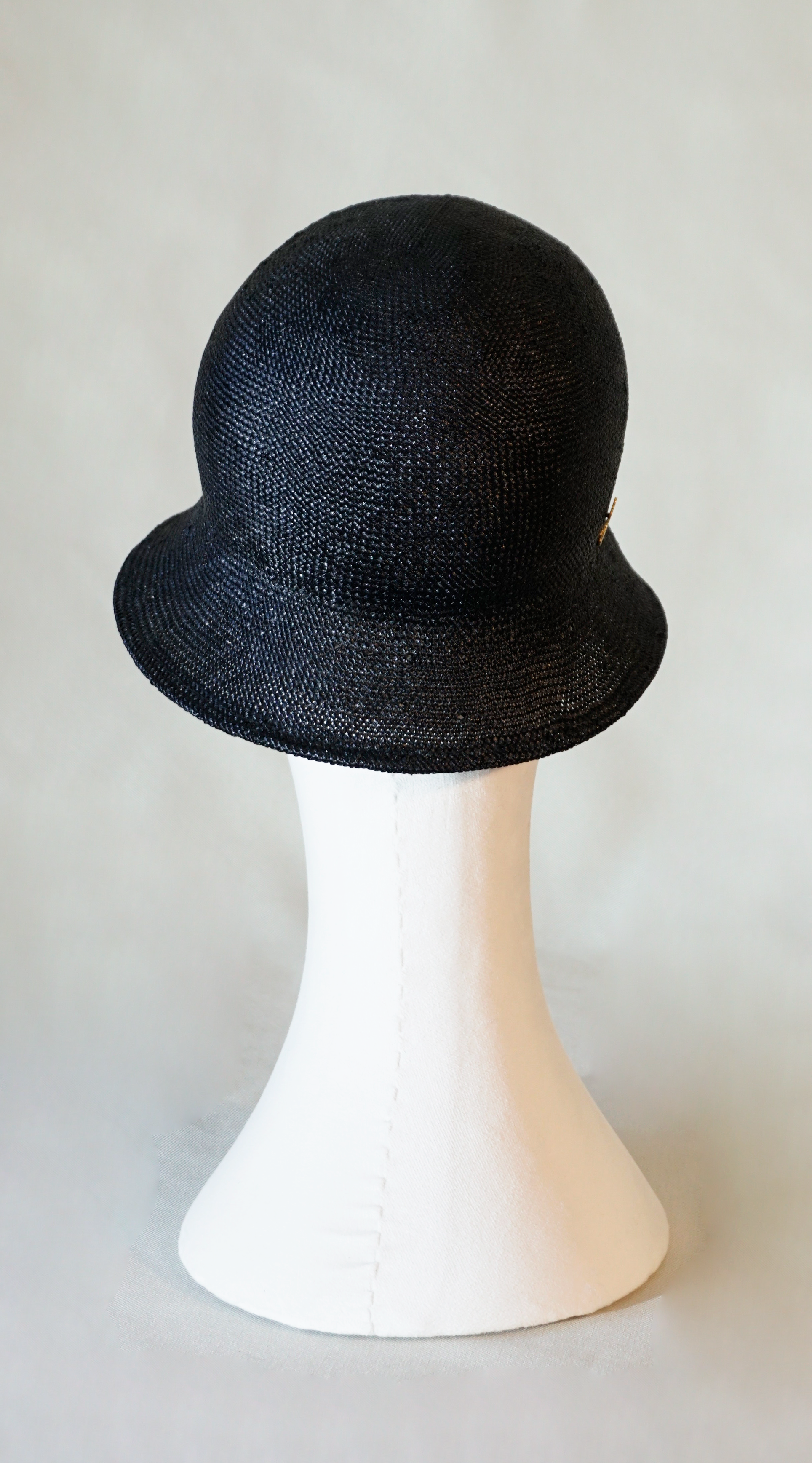 Nyx Cloche Hat in Visca Straw in Black with a Gold Lyre by Anna Xaniotaki, back view