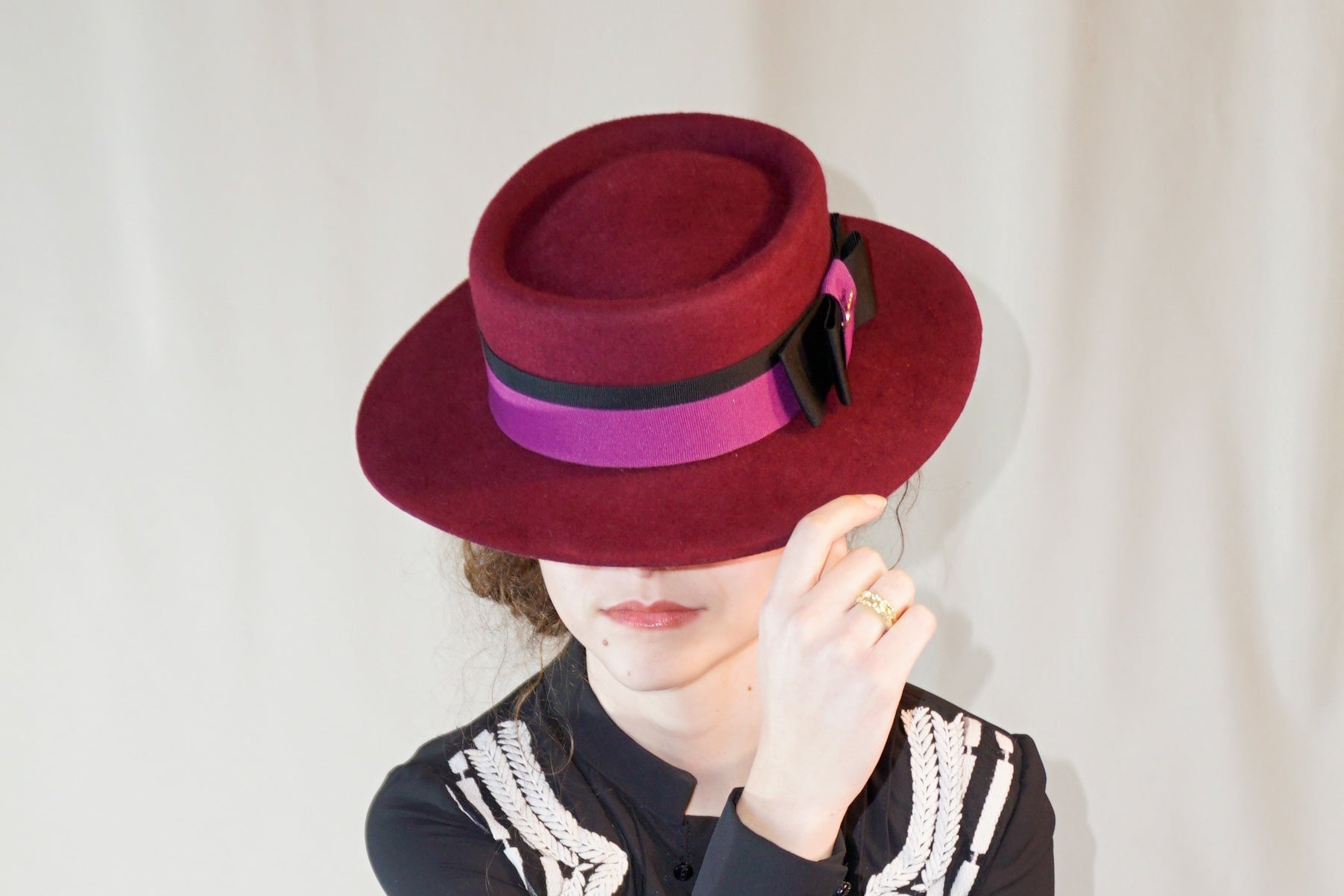 Scarlet Ode - burgundy felt boater hat with double bow and 14ct gold-plated lyre by Anna Xaniotaki