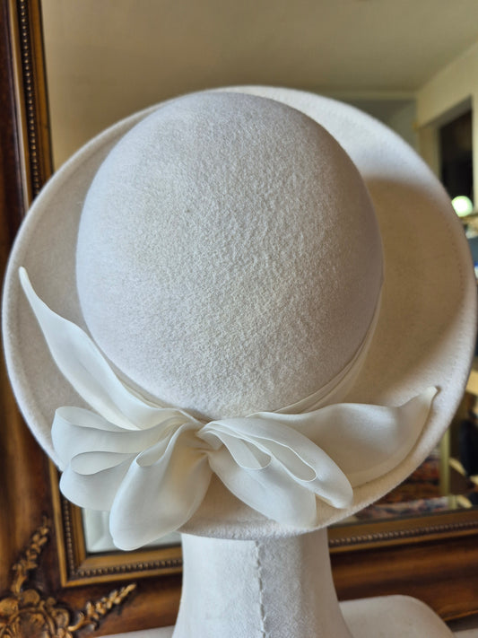 Ivory felt halo hat with silk organza bow by Anna Xaniotaki back view by Anna Xaniotaki
