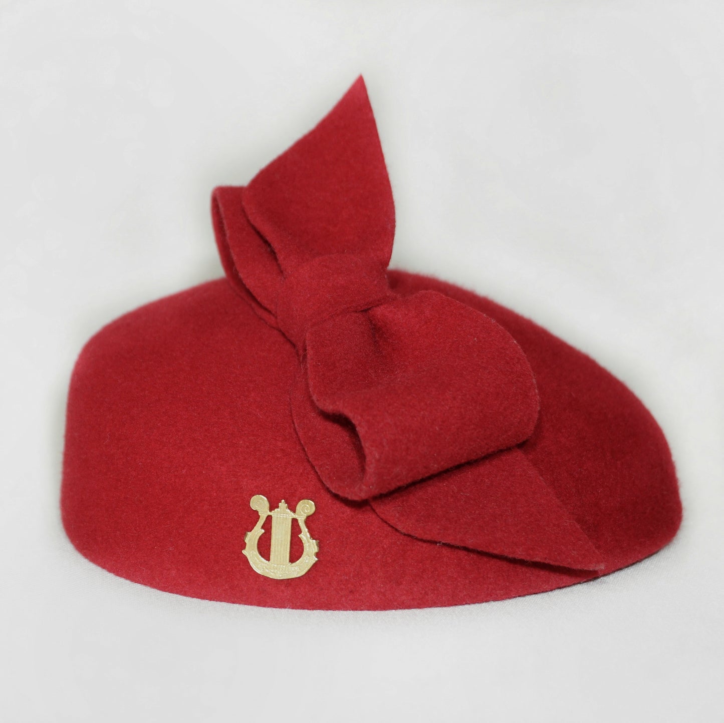 Erato Ode Red Felt Pillbox Hat with Bow & Gold Lyre by Anna Xaniotaki, right side view