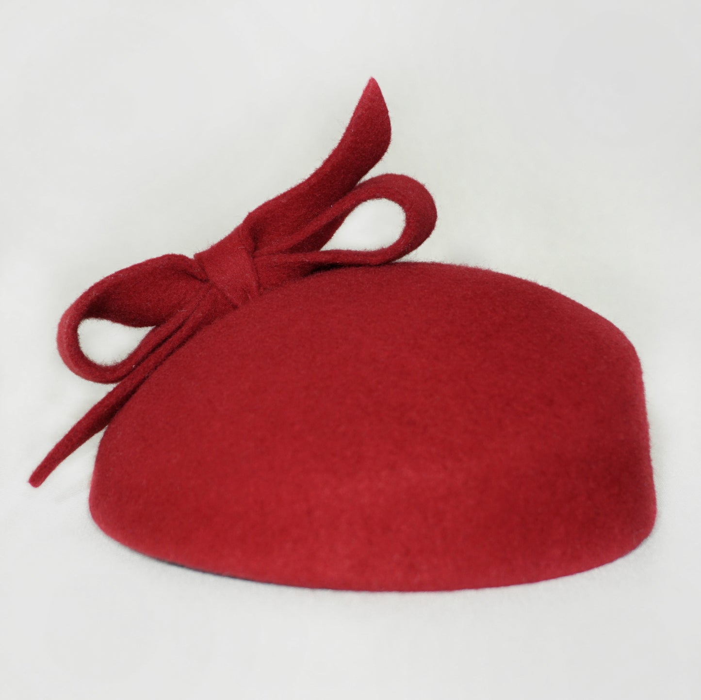 Erato Ode Red Felt Pillbox Hat with Bow & Gold Lyre by Anna Xaniotaki - front view