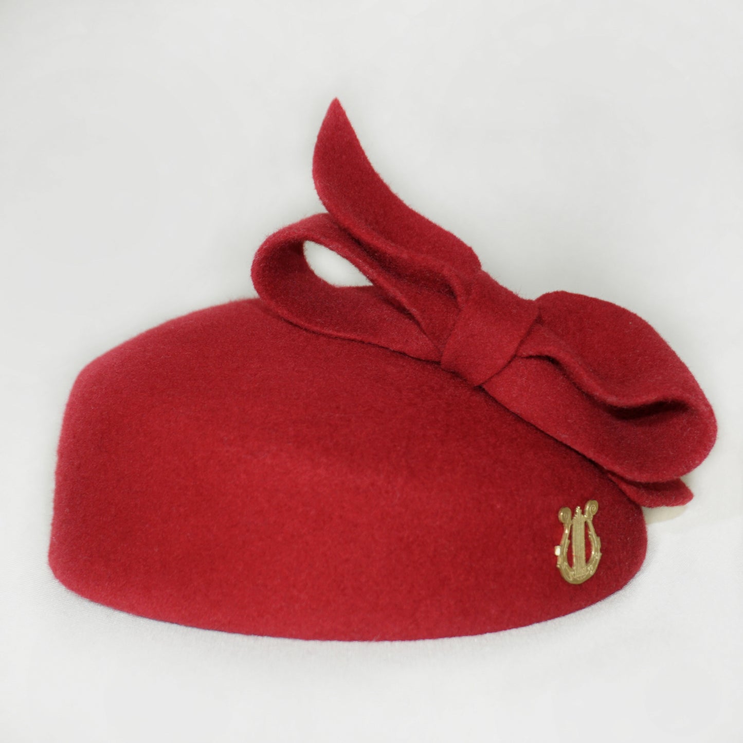 Erato Ode Red Felt Pillbox Hat with Bow & Gold Lyre by Anna Xaniotaki - back view
